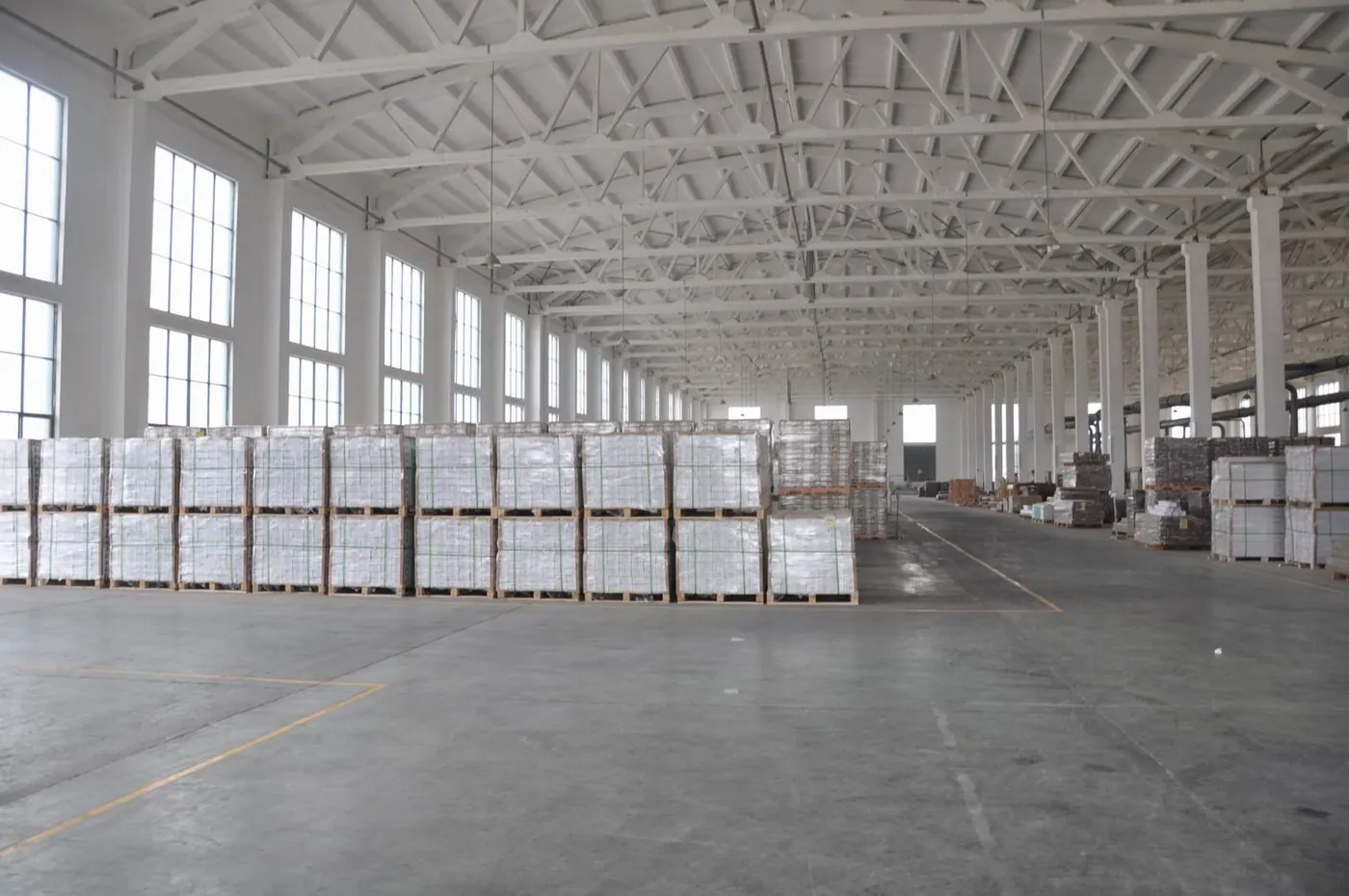 Clean production warehouse with packed flooring materials